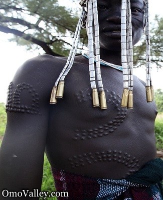 Man of the Mursi Tribe with body scars